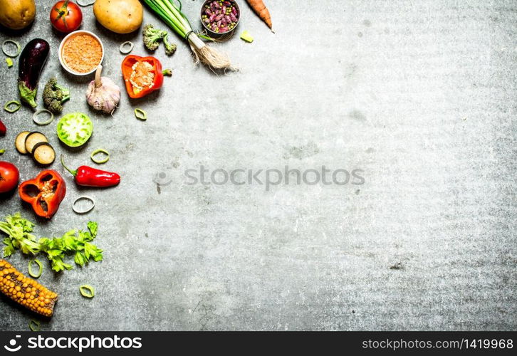 Organic food. Fresh slices of vegetables with spices. On the stone table.. Organic food. Fresh slices of vegetables with spices.