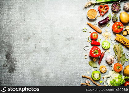 Organic food. Fresh slices of vegetables with spices. On the stone table.. Organic food. Fresh slices of vegetables with spices.