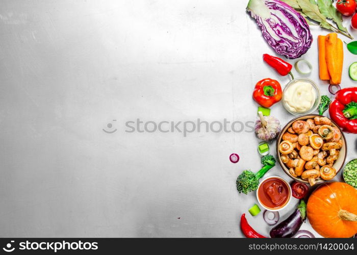 Organic food. Fresh vegetables with mushrooms. On the steel background .. Fresh vegetables with mushrooms.