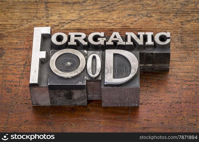 organic food text in mixed vintage metal type printing blocks over grunge wood