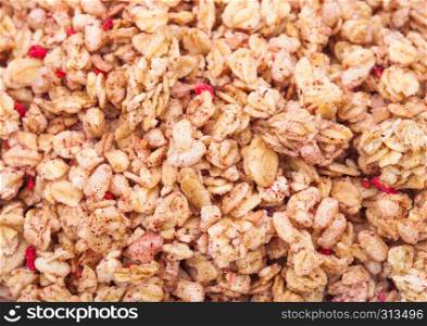Organic fresh cereal granola flakes with fruits macro texture