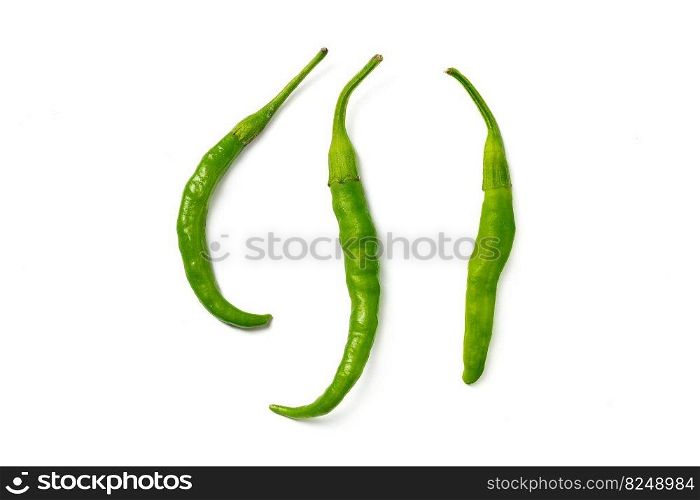 Organic fresh green hot chilli pepper isolated on a white background