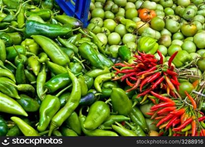 Organic Fresh Ripe Green and Red Peppers and Green Tomatoes At A Street Market In Istanbul, Turkey. Carsamba Fatih Pazari (Bazaar)