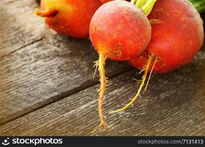 Organic golden beets on rustic wooden background .. Organic golden beets on rustic wooden background