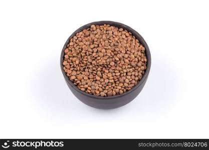 Organic lentils in bowl Isolated on a white background - close up shot