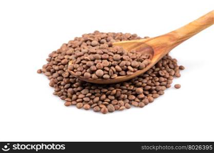 Organic lentils in spoon Isolated on a white background - close up shot