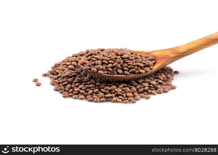 Organic lentils in spoon Isolated on a white background - close up shot