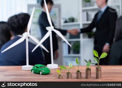 Organic money growth investment concept shown by stacking piles of coin with sprout or baby plant on top. Financial investments rooted and cultivating sustainable clean energy with nature. Quaint. Organic money growth investment concept with stacking coin and plant. Quaint