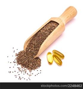 Organic natural chia seeds and wooden scoop close-up and omega pills. High quality photo. Organic natural chia seeds and wooden scoop close-up and omega pills