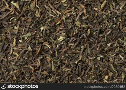 Organic Nepal Oolong Jun Chiyabari dried tea leaves full frame close up as background 