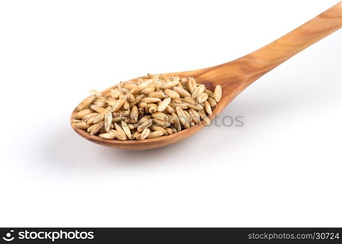 organic oat grains isolated on white background in wooden spoon