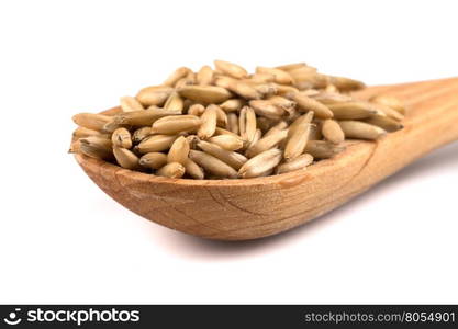 organic oat grains isolated on white background in wooden spoon