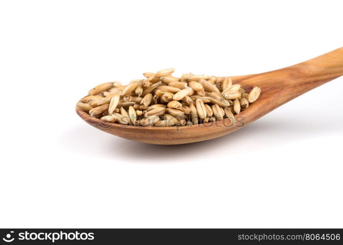 organic oat grains isolated on white background in wooden spoon