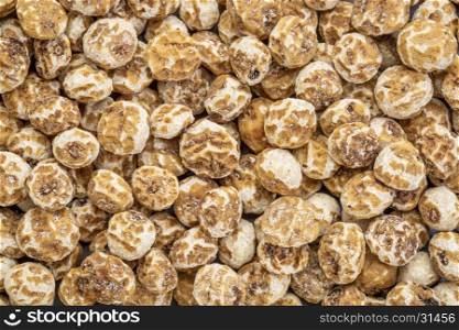 organic peeled tiger nuts, a rich source of resistant starch, top view background