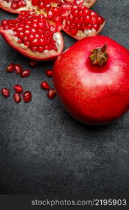 Organic Pomegranate and seeds close-up macro studio shot. Pomegranate and seeds close-up