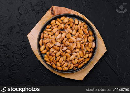 Organic roasted salty peanuts in a pan