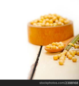 organic soya beans over rustic wood table macro closeup