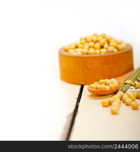 organic soya beans over rustic wood table macro closeup