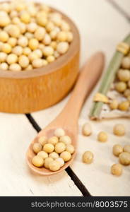 organic soya beans over rustic wood table macro closeup