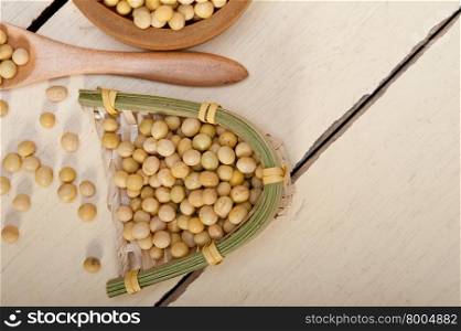 organic soya beans over rustic wood table macro closeup