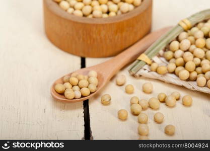 organic soya beans over rustic wood table macro closeup