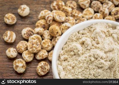 organic tiger nuts, a rich source of resistant starch - peeled nuts and powder for smoothies