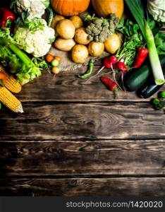 Organic vegetables. Different raw vegetables . On wooden background. Different raw vegetables .