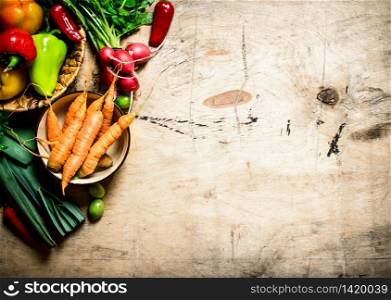 Organic vegetables. Fresh vegetables on a wooden table.. Fresh vegetables on wooden table.