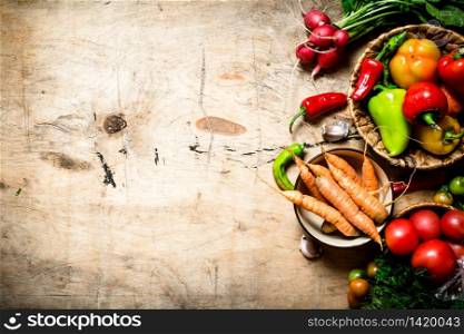 Organic vegetables. Fresh vegetables on a wooden table.. Fresh vegetables on wooden table.