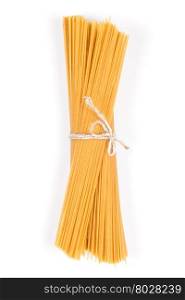 Organic whole wheat spaghetti pasta on white background