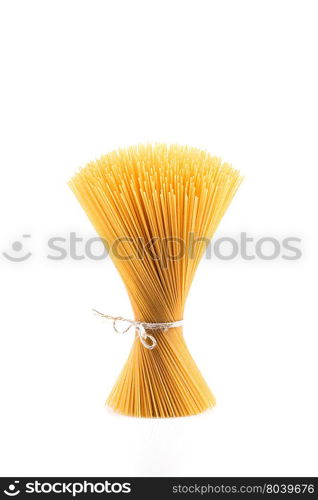 Organic whole wheat spaghetti pasta on white background