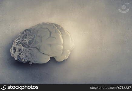 Organization ability. Model of human brain and cogwheel mechanism