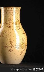 oriental antique ceramic vase on a black background closeup. oriental antique ceramic vase