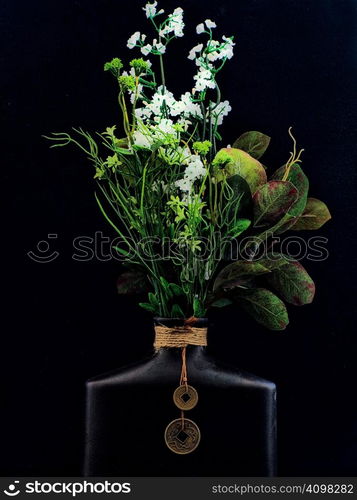 Oriental clay vase and bouquet.