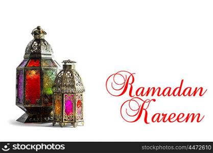 Oriental colorful light lantern on white background. Arabic holidays decoration. Sample text Ramadan kareem