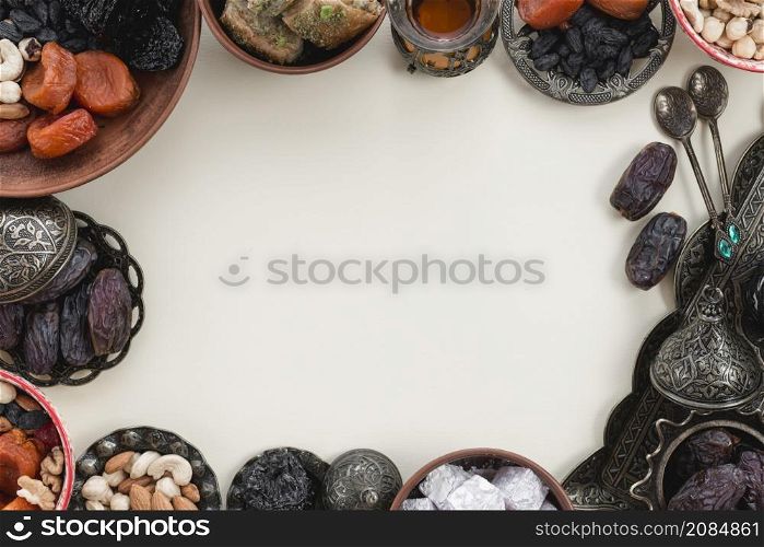 oriental holidays decoration with dates fruits dates lukum nuts white background with space center writing text