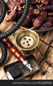 oriental nargile with dates. hookah with tobacco shisha flavor of dates