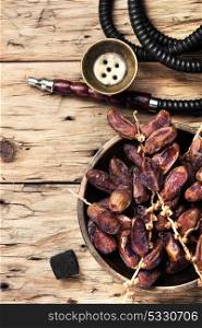 oriental nargile with dates. hookah with tobacco shisha flavor of dates