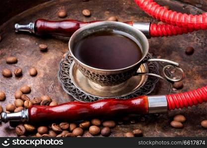 Oriental shisha hookah with aroma coffee for relax.Modern hookah with coffee.Traditional arabic shisha. Hookah with aroma coffee