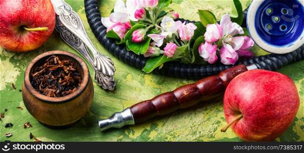 Oriental smoking hookah. Arabian shisha with apple. Hookah with apple.Fruit smoking hookah. Shisha with apple tobacco