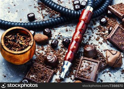 Oriental smoking hookah with a taste of chocolates. Chocolate tobacco flavor.. Tobacco shisha with chocolate flavor