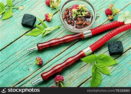 Oriental smoking hookah with tobacco with the aroma of raspberry jam.. Hookah with a taste of raspberry jam.
