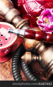 Oriental tobacco hookah with floral aroma. Smoke hookah with floral scent.Shisha concept.Modern hookah