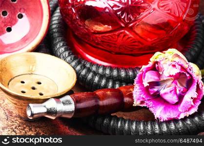 Oriental tobacco hookah with floral aroma. Smoke hookah with floral scent.Shisha concept.Modern hookah