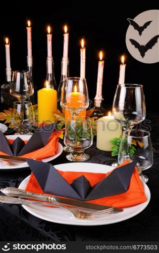 Origami bat on a napkin as an element of decor table