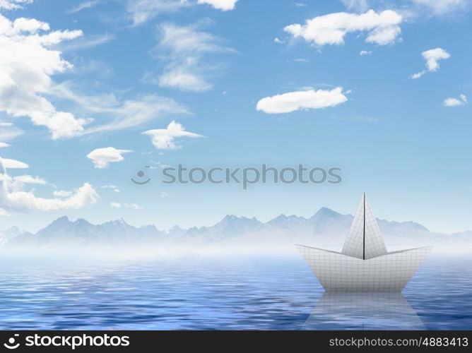 Origami boat. Boat made of paper sailing on blue water surface