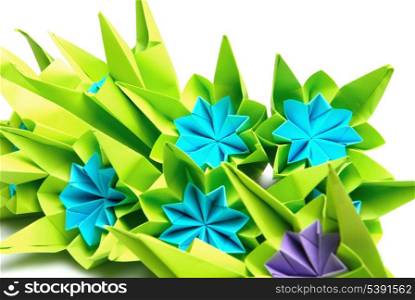Origami bunch of blue flowers isolated on white