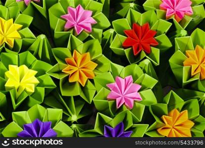 Origami bunch of various flowers close up background