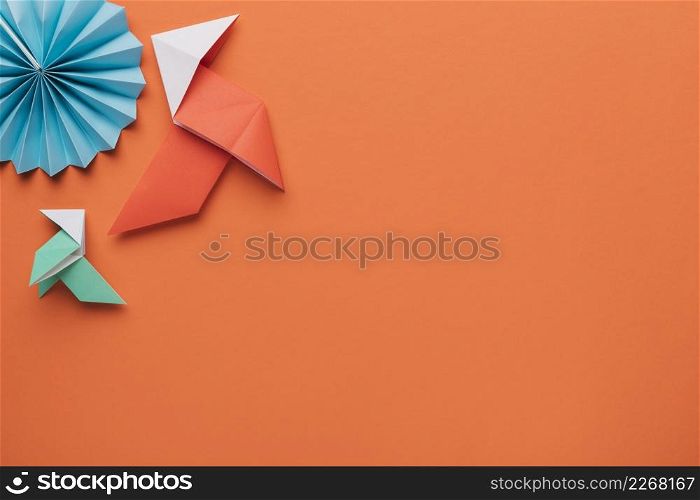 origami paper craft art dark orange surface