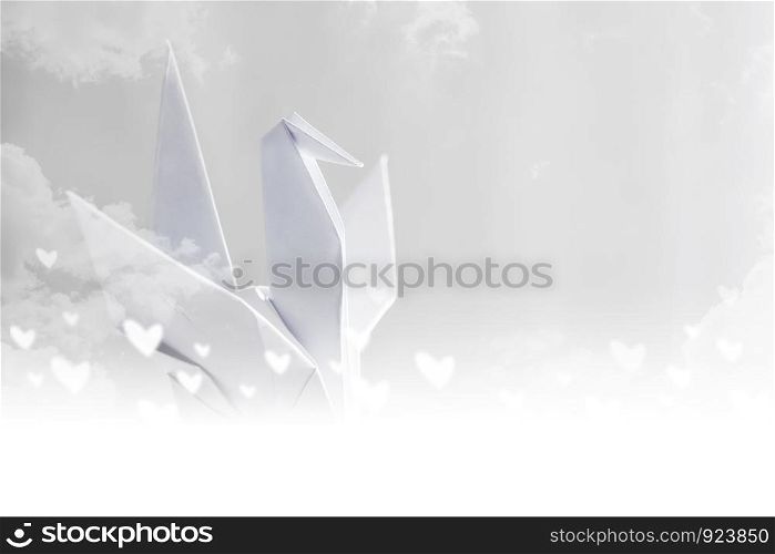 Origami paper crane on sky